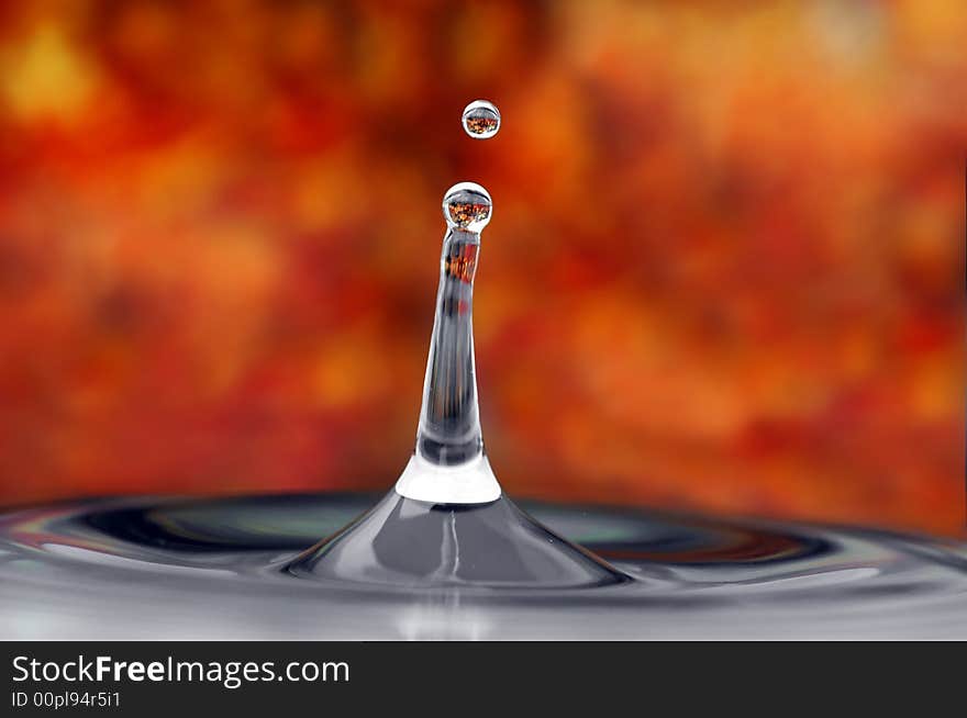 Isolated tower of water and droplet in an autumn environment