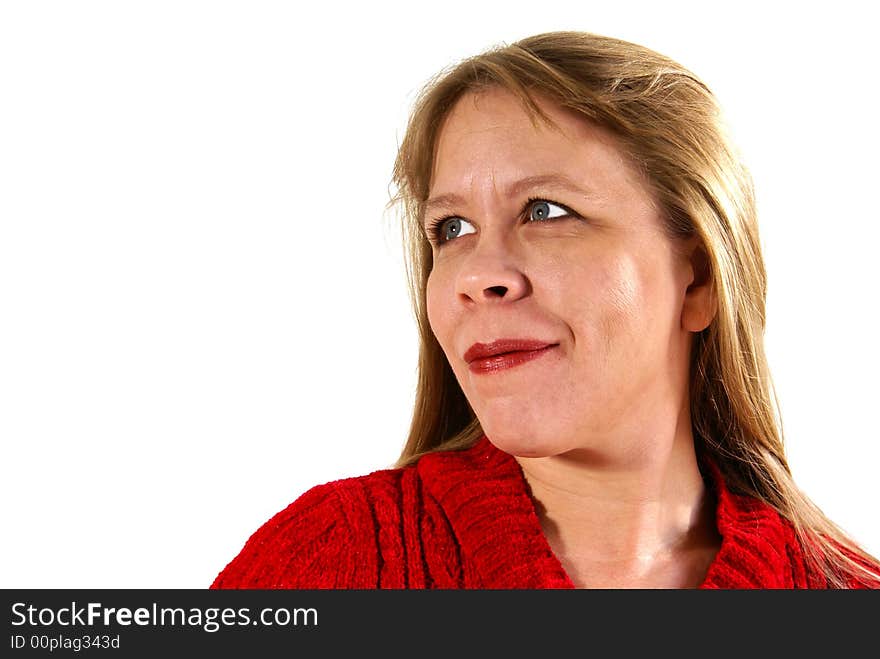 Pretty woman with blonde hair in red sweater looking over shoulder. Isolated on white