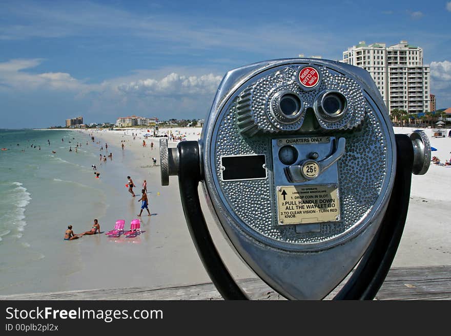 Beach telescope looking over the beach during a summer holiday