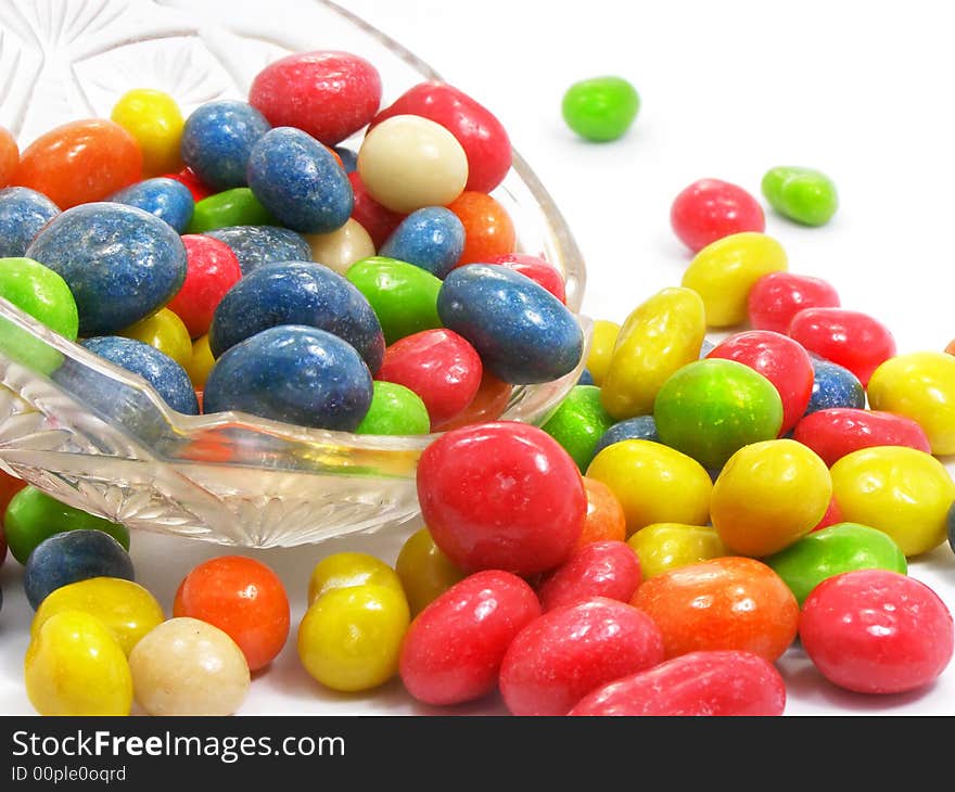 Group of coloured sweet candies isolated over white background