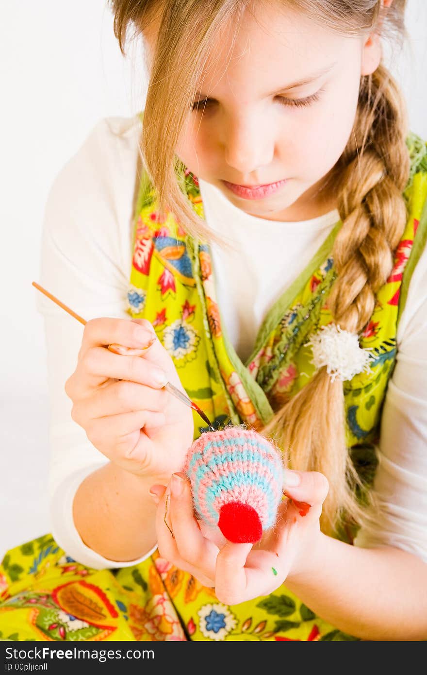 Young Girl Painting Eggs For Easter