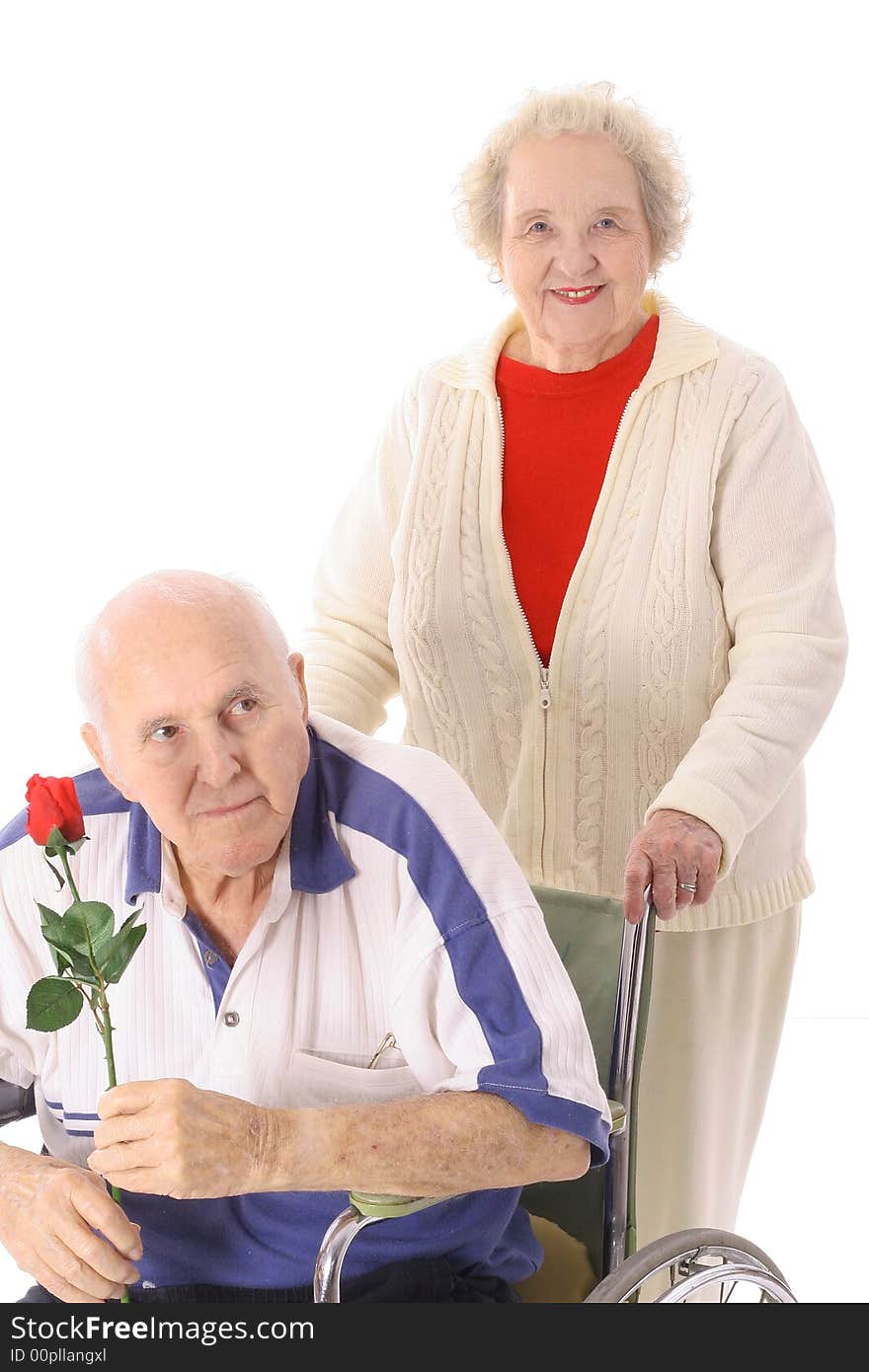 Wife Pushing Elderly Husband