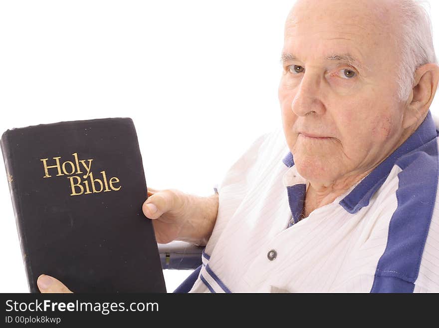 Grandfather with a bible isolated on white