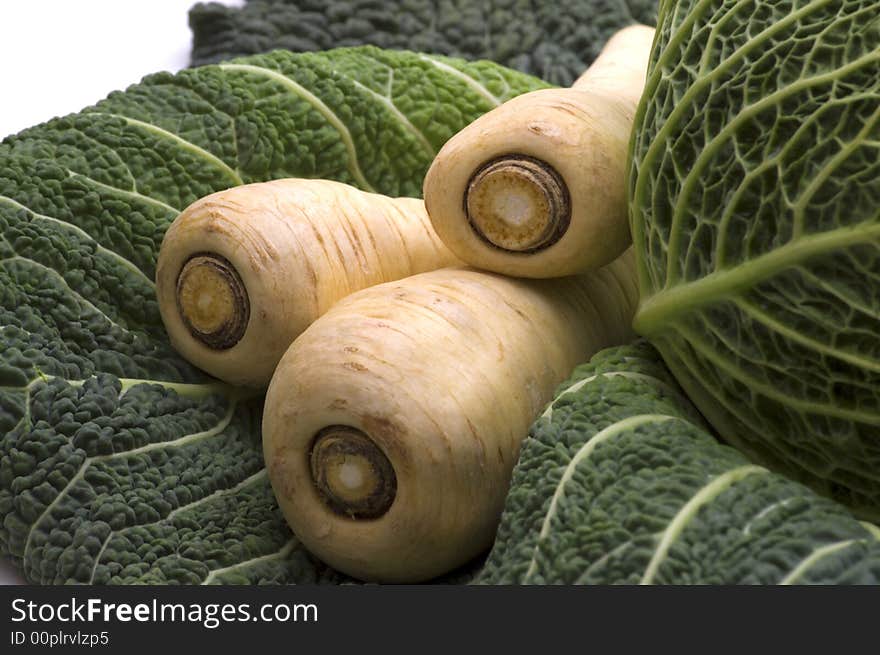 Yellow radish on cabbage leaf