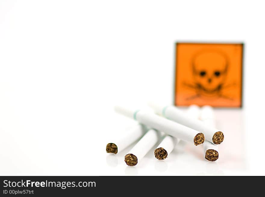 Cigarets and skull on white background