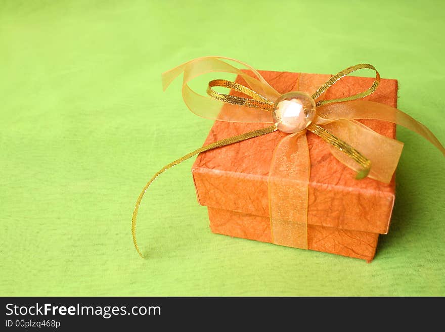 Brown Gift box with gold and copper ribbon