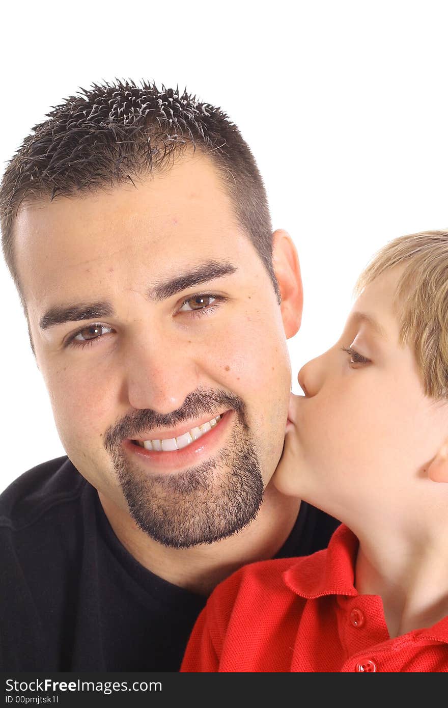 Little boy kissing father isolated on white