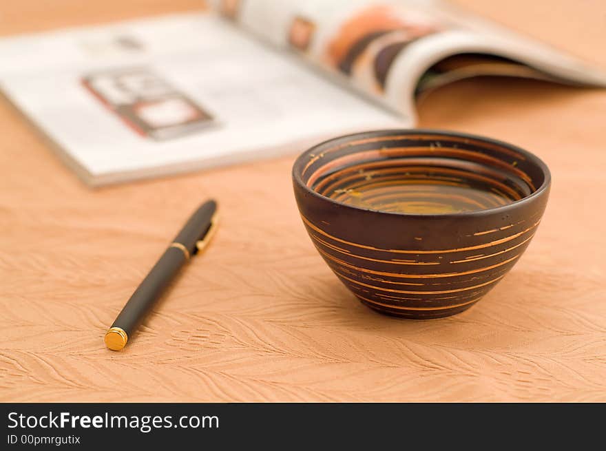 Cup of tea with pen and journal. Cup of tea with pen and journal