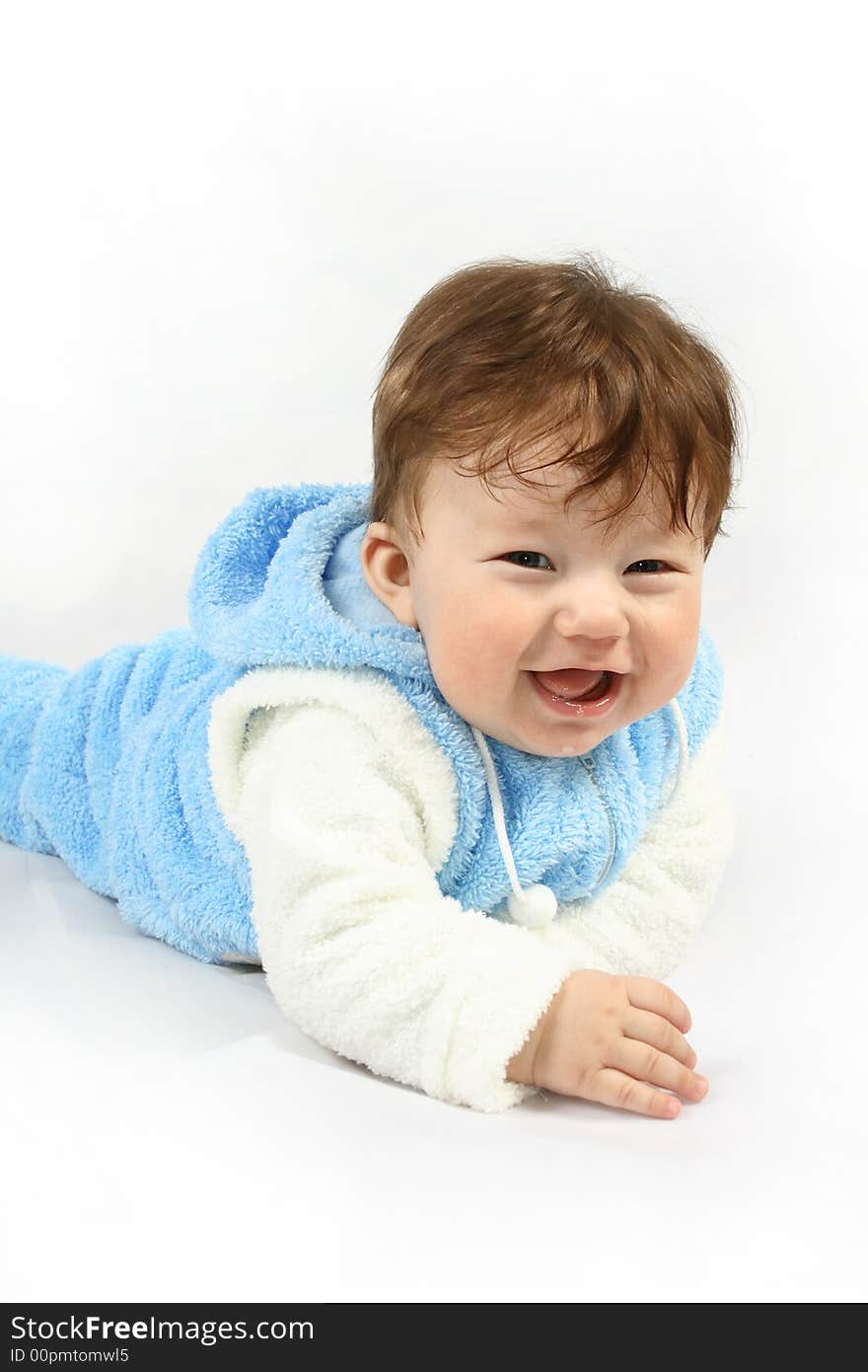 Small happy child with blue clothing against the white background. Small happy child with blue clothing against the white background