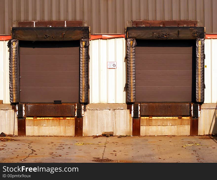 Exterior loading dock doors for the loading and unloading of shipping trailers and containers.