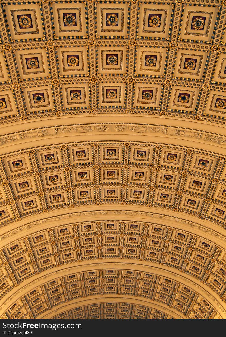 Ornate golden ceiling with car