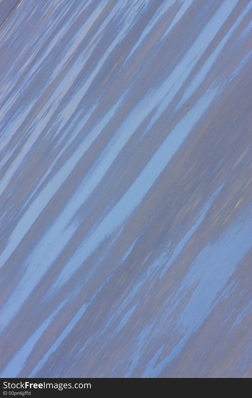 Ice with wet spots reflecting the cool blue sky. Ice with wet spots reflecting the cool blue sky