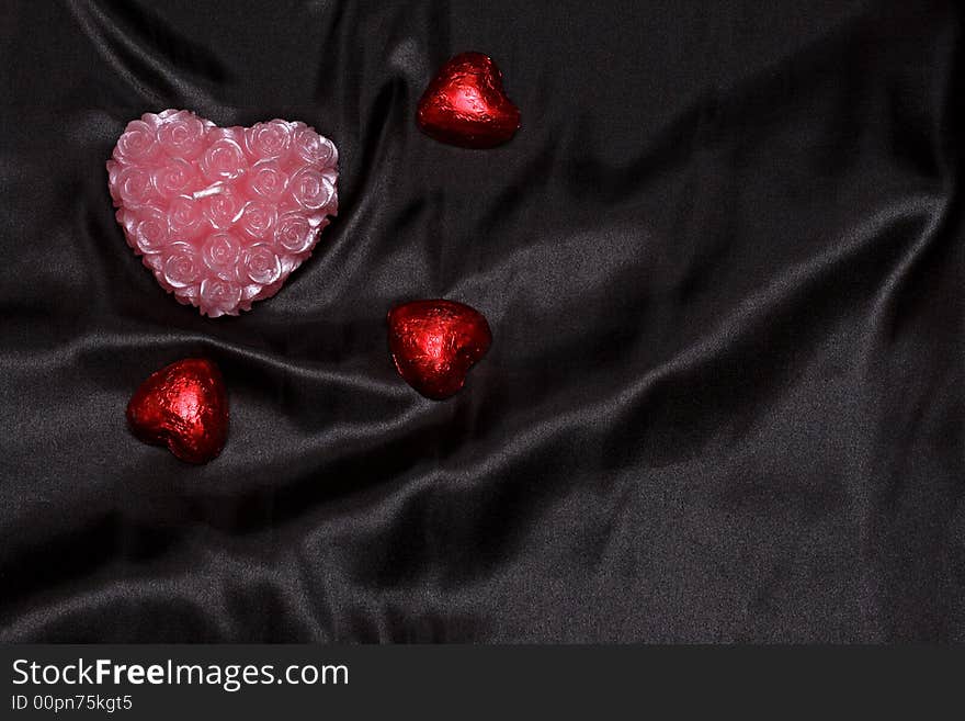 Heart shapes on black satin