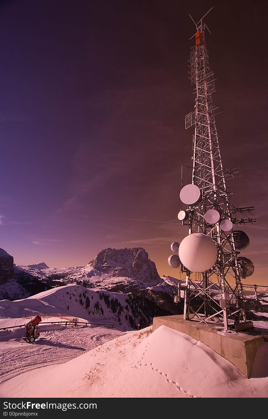 Large Antenna on Snowcapped Mountain