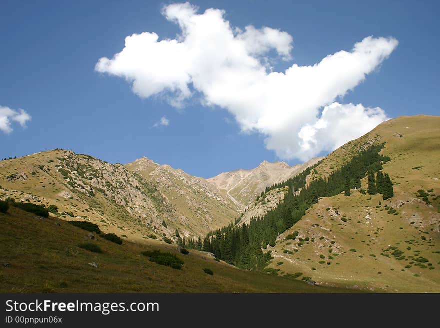 Mountains. The sky. Clouds.