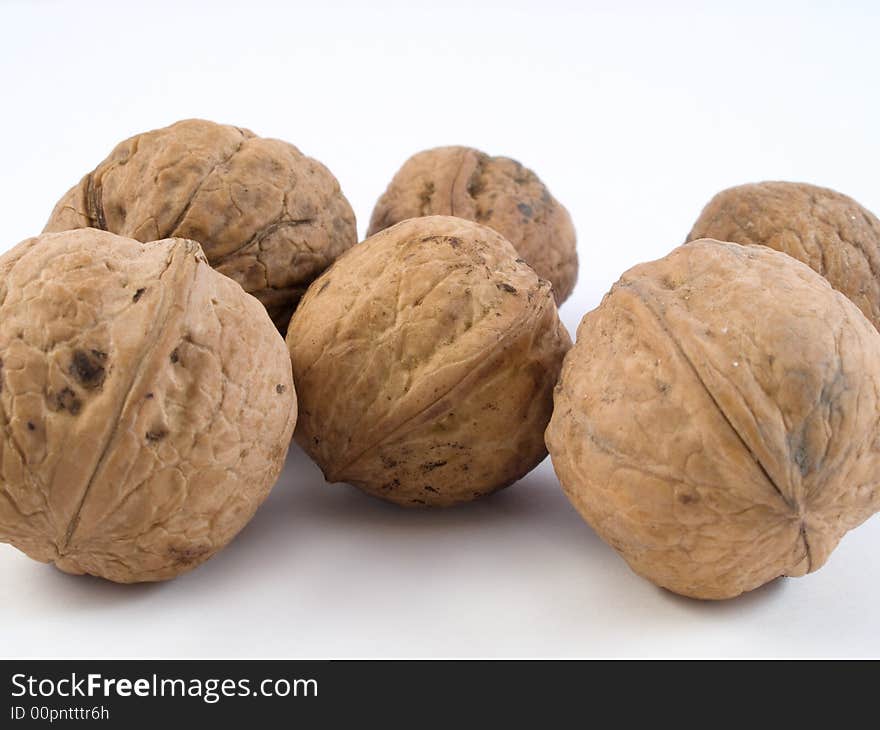 Close up of several closed walnut shells. Close up of several closed walnut shells