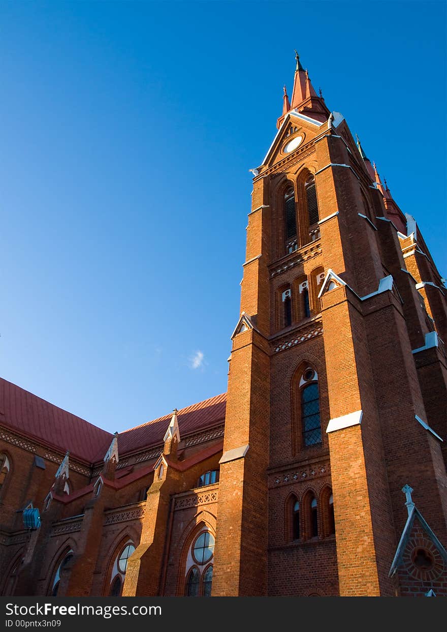 Tall old red brick church tower