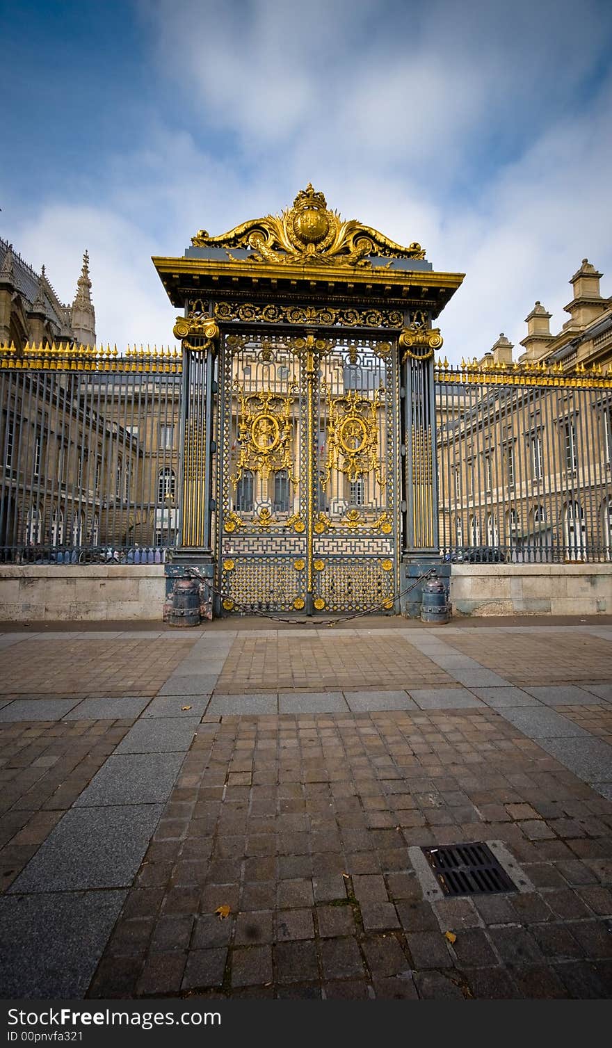 Wide angle view of an imposing golden gateway.