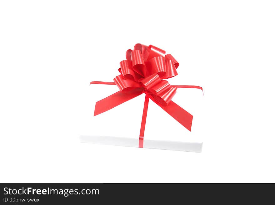 Gift box with a ribbon isolated on white. Gift box with a ribbon isolated on white