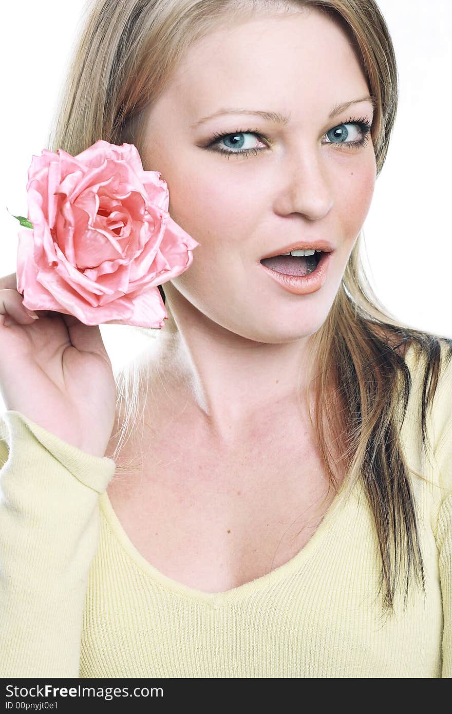 The portrait of the beautiful girl on white background with flower