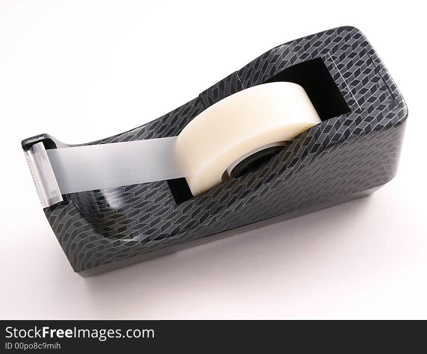 Tape dispenser with patterned design on white. Tape dispenser with patterned design on white