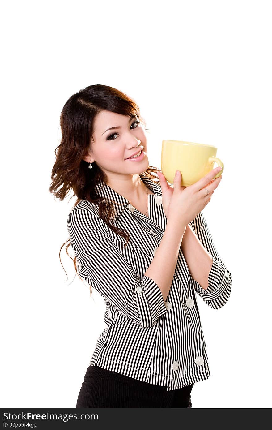 Young woman holding a big green cup with both hands smiling. Young woman holding a big green cup with both hands smiling