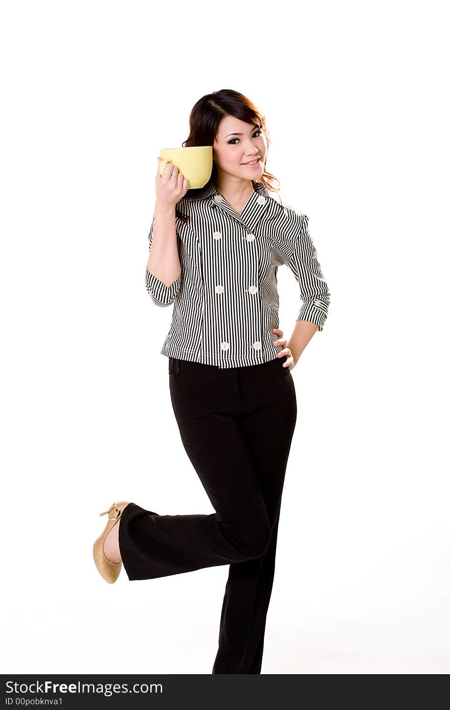 Young woman holding a big green cup with both hands smiling. Young woman holding a big green cup with both hands smiling