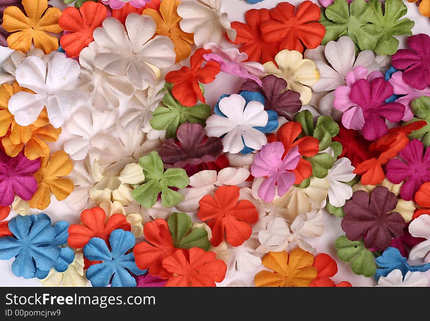 Colorful paper flowers spread out as a background. Colorful paper flowers spread out as a background