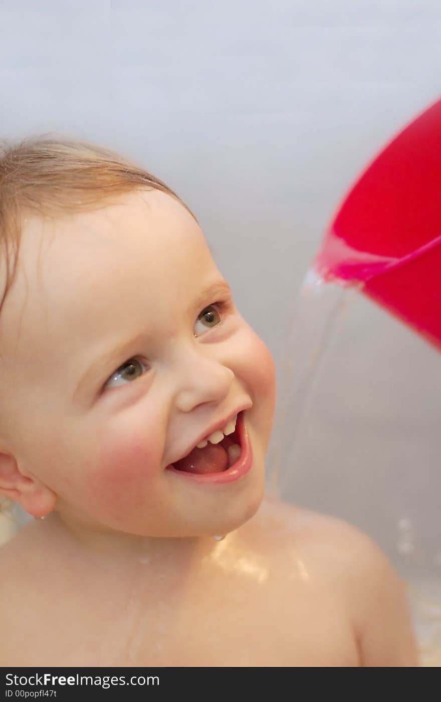 Baby in bathroom washing