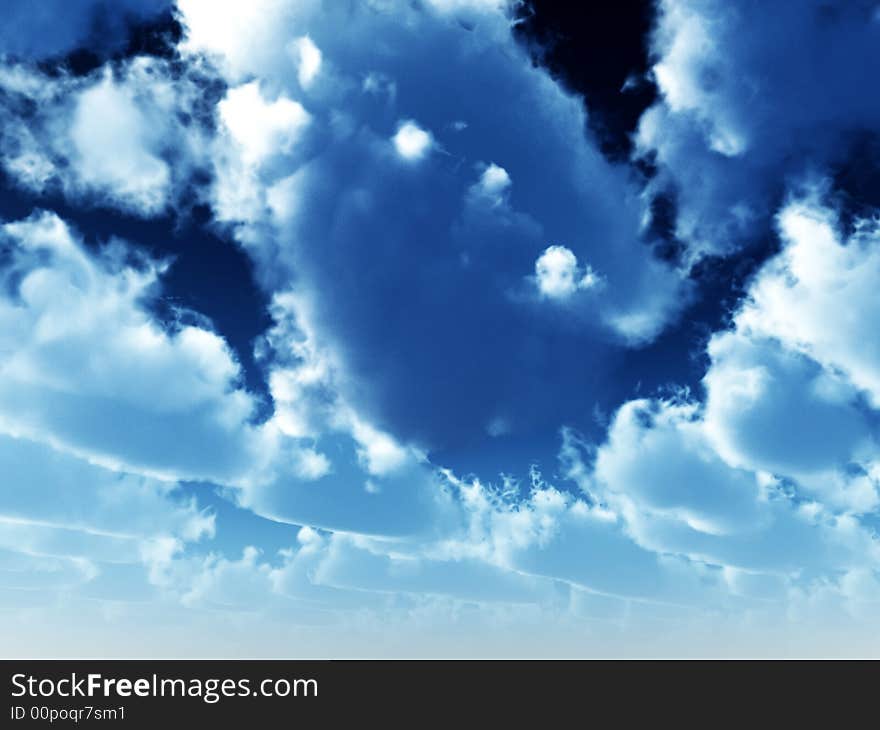 An background image of some clouds in a sunny daytime sky. An background image of some clouds in a sunny daytime sky.