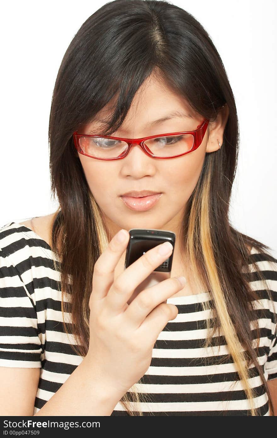 A woman sending a text message on her cellphone