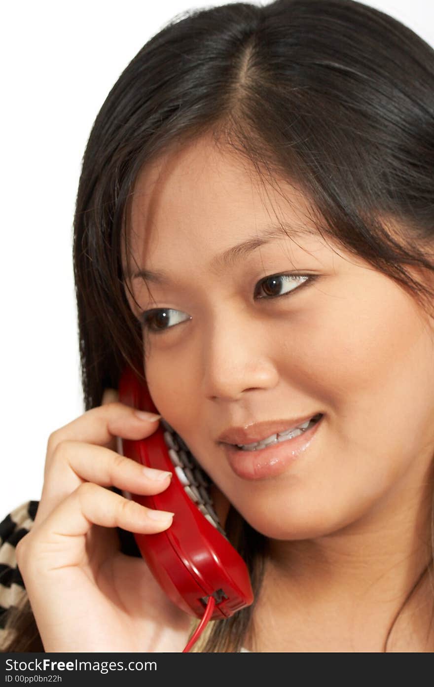 A smiling woman talking on the phone. A smiling woman talking on the phone