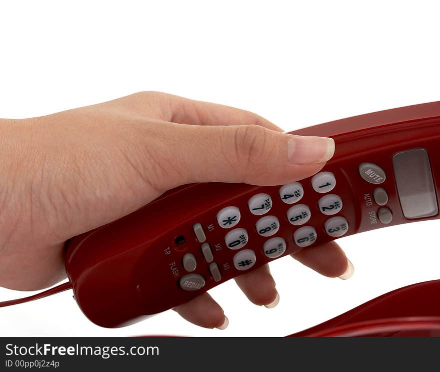 A hand picking up a phone over a white background. A hand picking up a phone over a white background