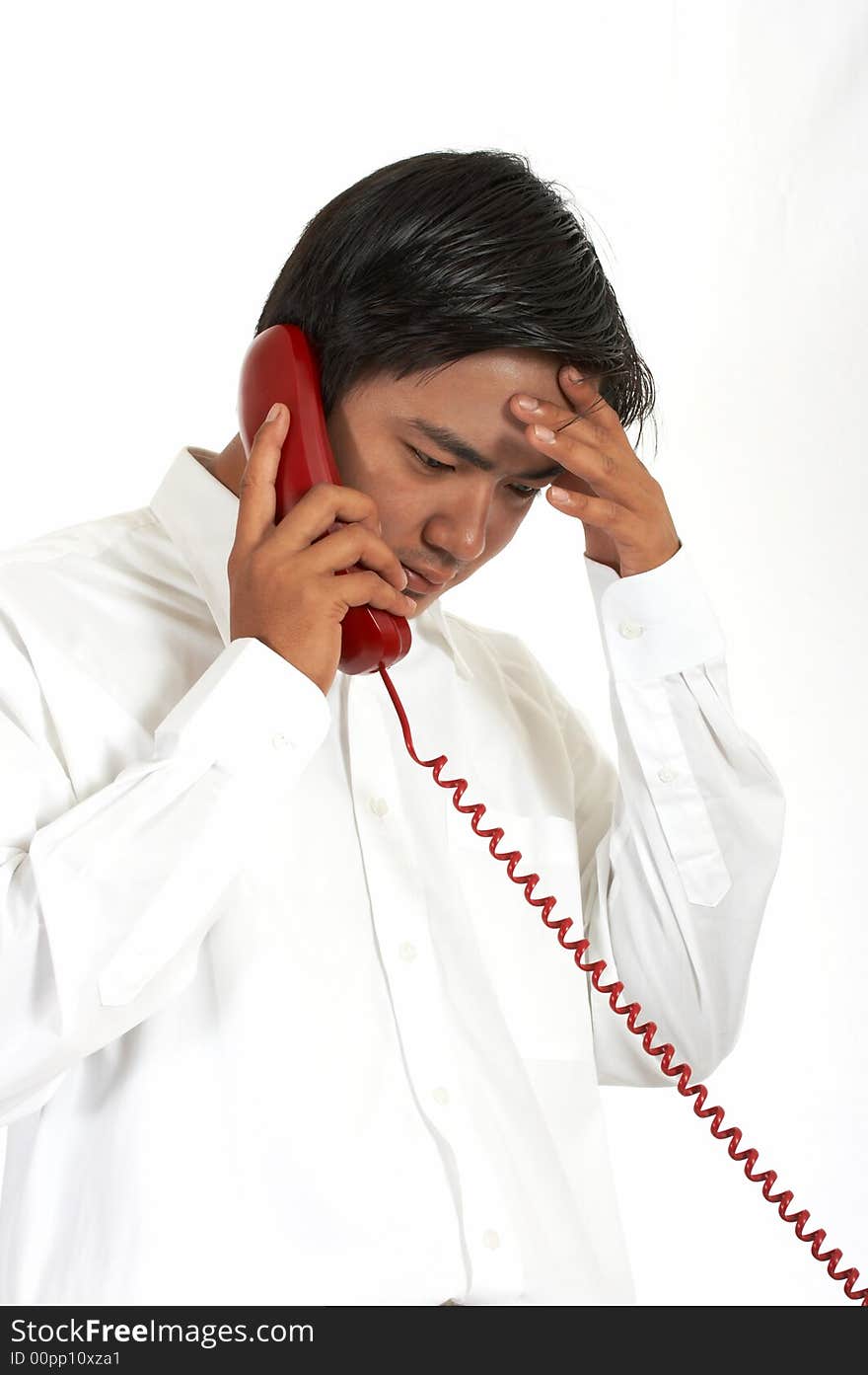 Man talking on a phone over a white background. Man talking on a phone over a white background