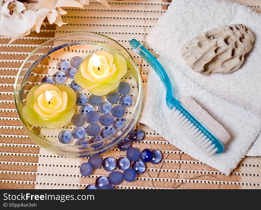 A spa items composition, bowl filed with water with lit candles. This image is a part of my Spa Collection, see my profile page for more details. A spa items composition, bowl filed with water with lit candles. This image is a part of my Spa Collection, see my profile page for more details.