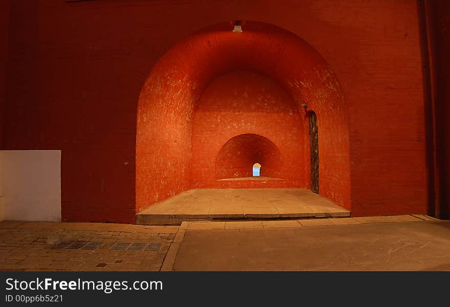 The big brick wall with an aperture. The exit is.