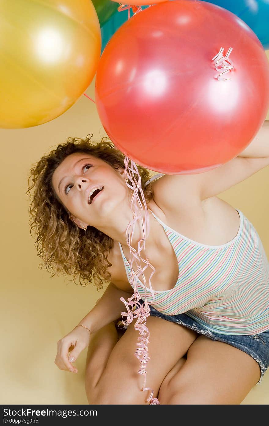 Attractive woman with balloons. Close-up portrait.