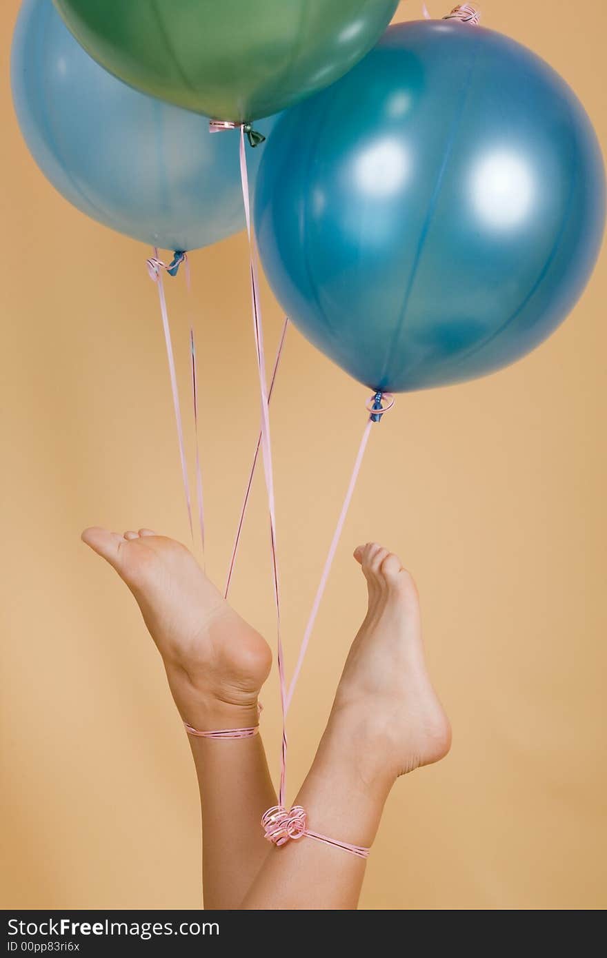 Color balloons adhered to a leg