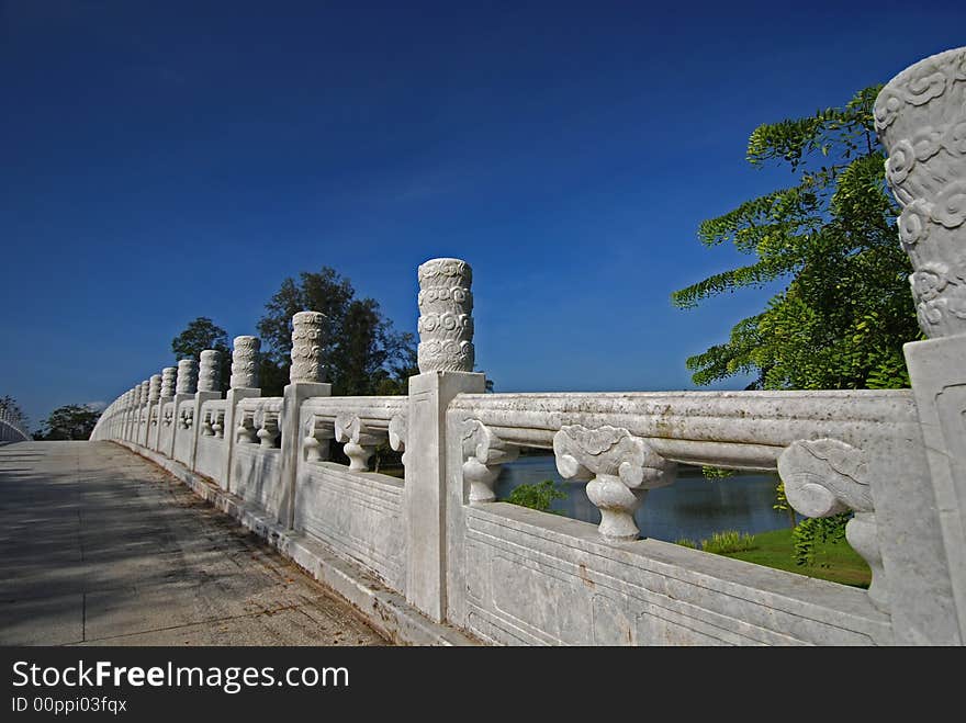 Stone bridge, tree and sky in the parks