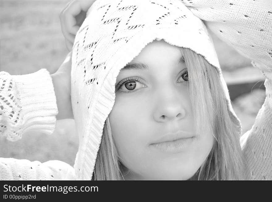 Beautiful blond girl wearing a white hood. Beautiful blond girl wearing a white hood