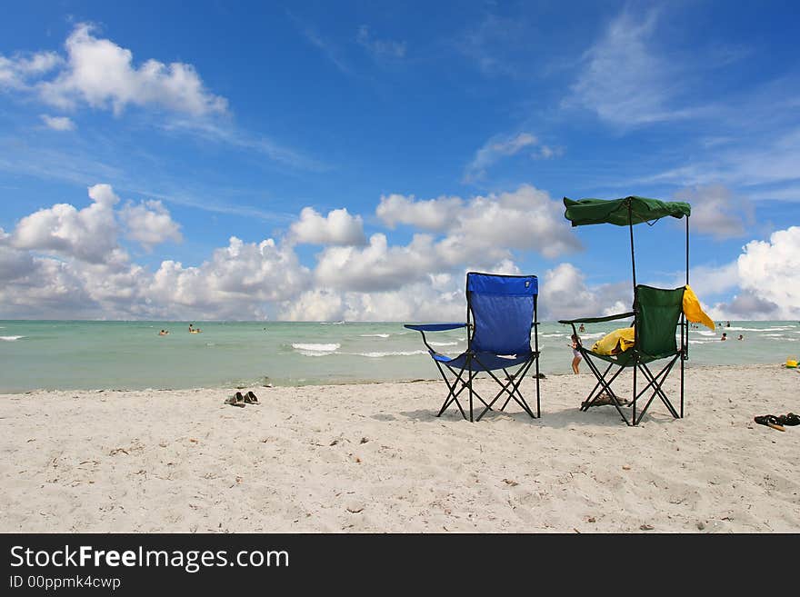 White Beach Chairs blue sky - South beach, Miami FL