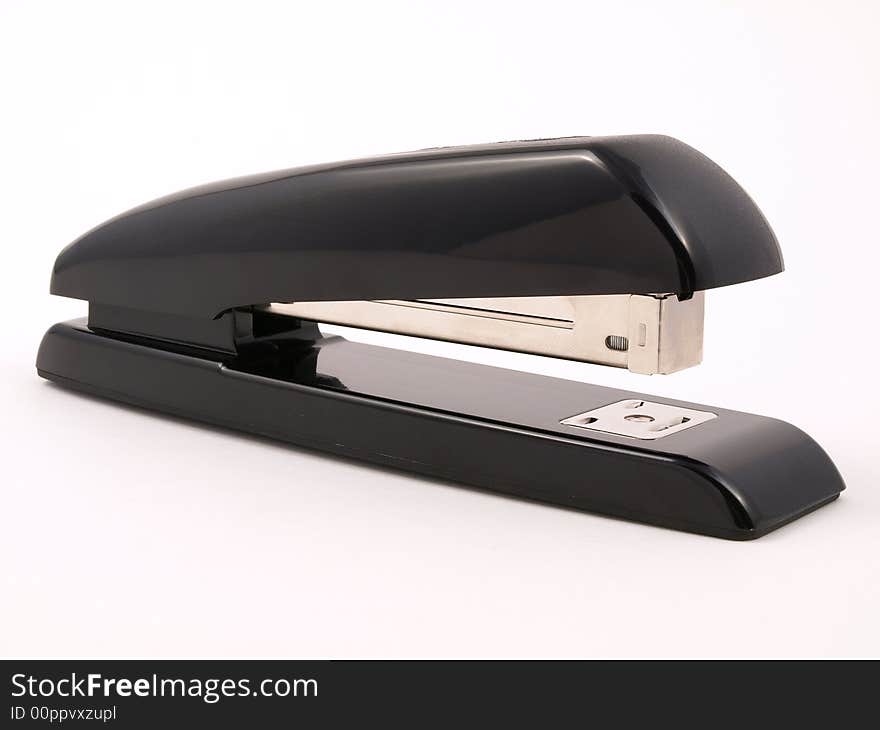 Black office stapler on white side view. Black office stapler on white side view