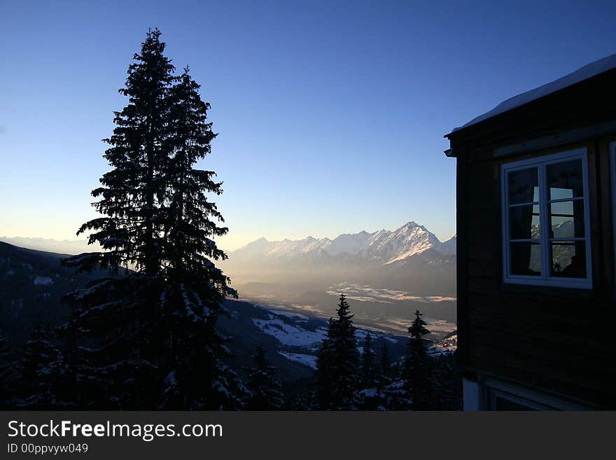 A shot in the alps with a beutiful sky and an alpine restaurant. A shot in the alps with a beutiful sky and an alpine restaurant.