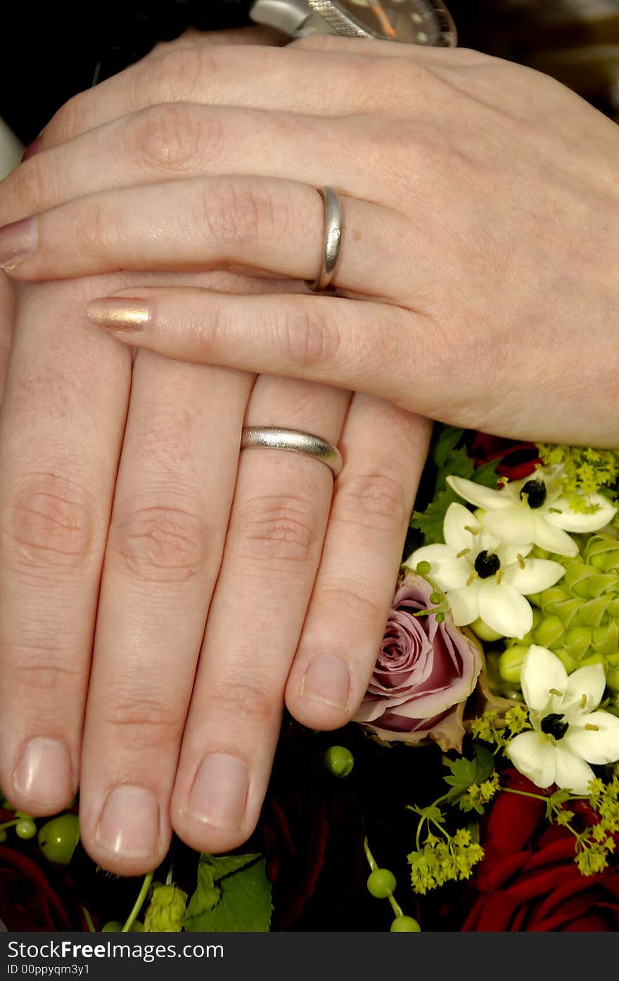 Wedding hands with rings and flowers. Wedding hands with rings and flowers