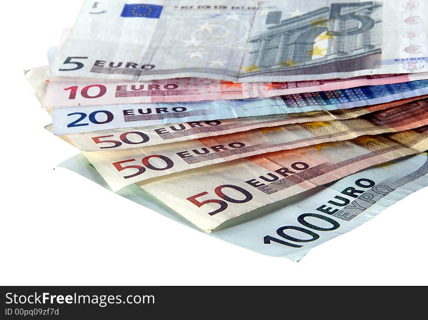 An isolated shot of Euro banknotes in all sizes. A lot of white space for text. An isolated shot of Euro banknotes in all sizes. A lot of white space for text.