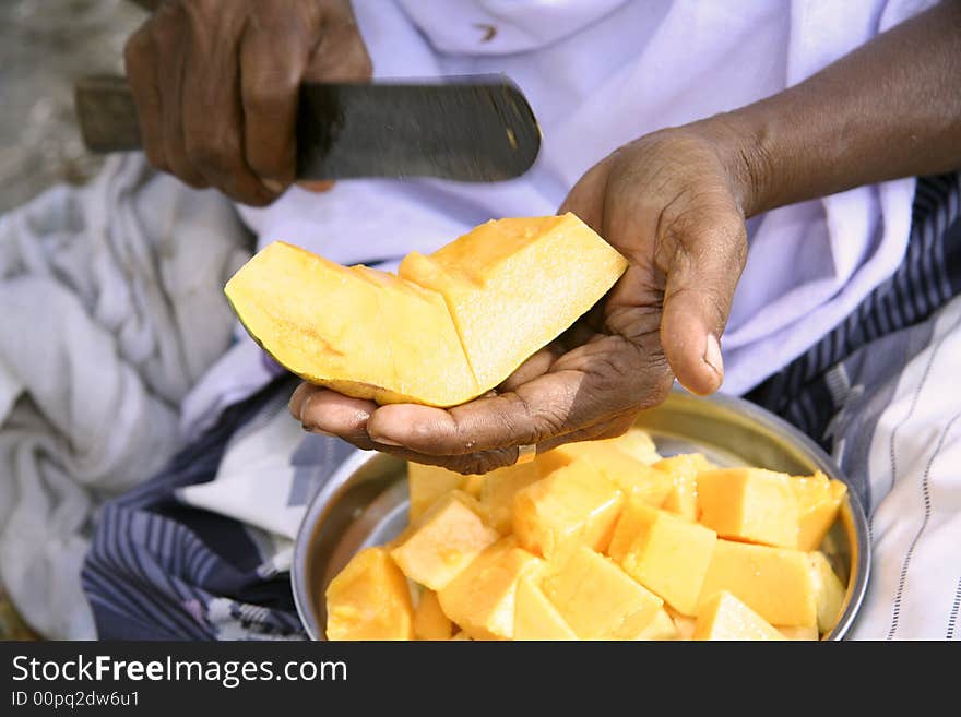 Vendor preparing fruit salad, kerala, india