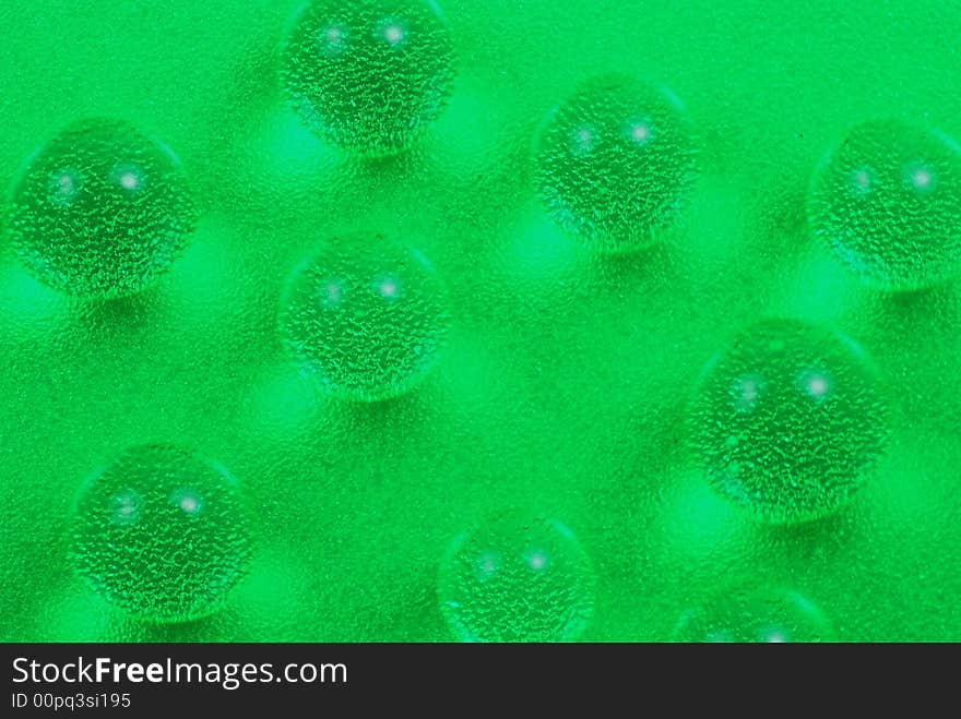 Macro shot of beautiful green water drops