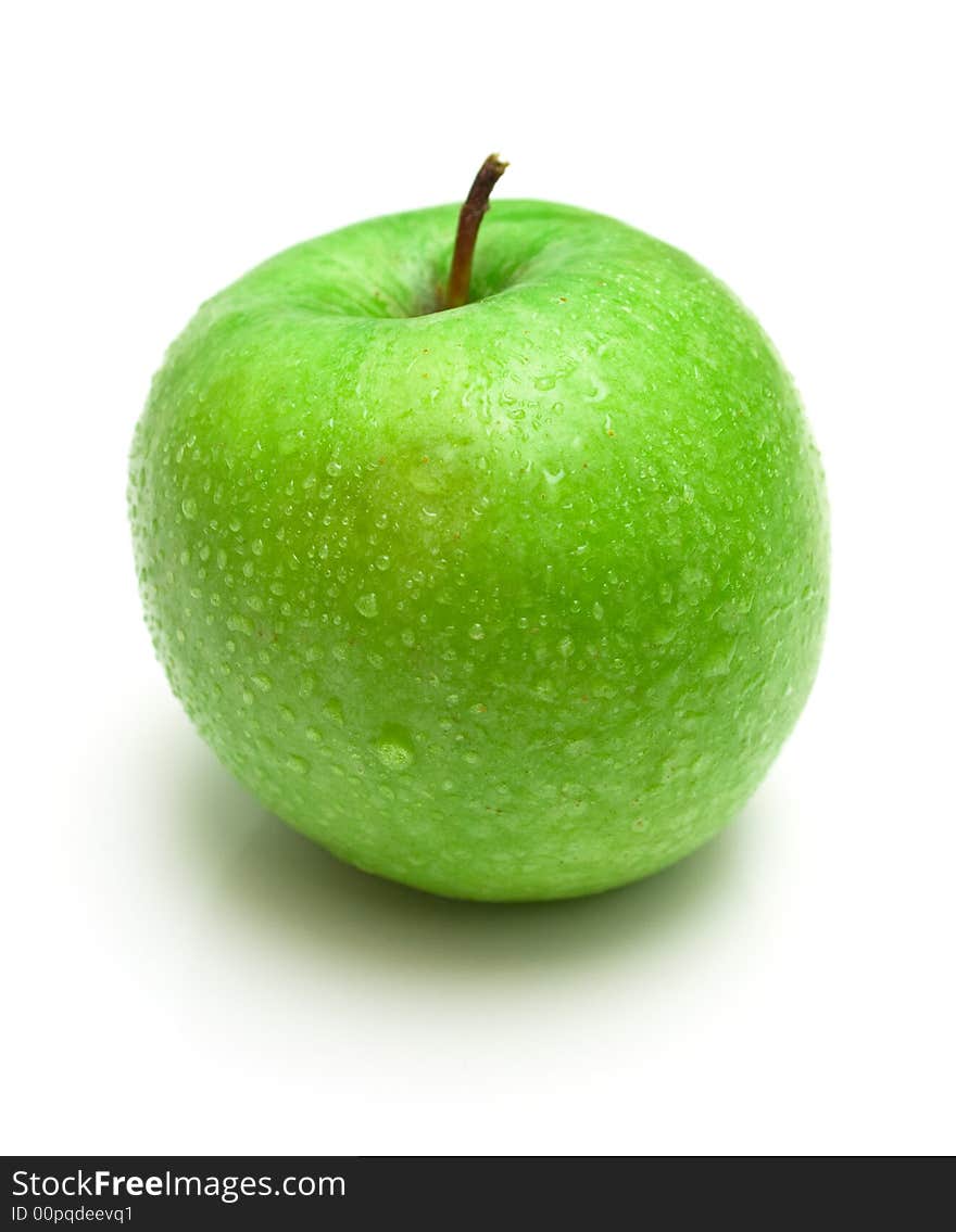 The ripe juicy apple covered by drops of water. Isolation on white, shallow DOF. The ripe juicy apple covered by drops of water. Isolation on white, shallow DOF.