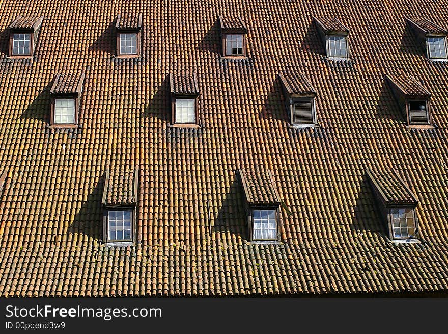 Rhythmic pattern of windows on the gothic style roof. Rhythmic pattern of windows on the gothic style roof