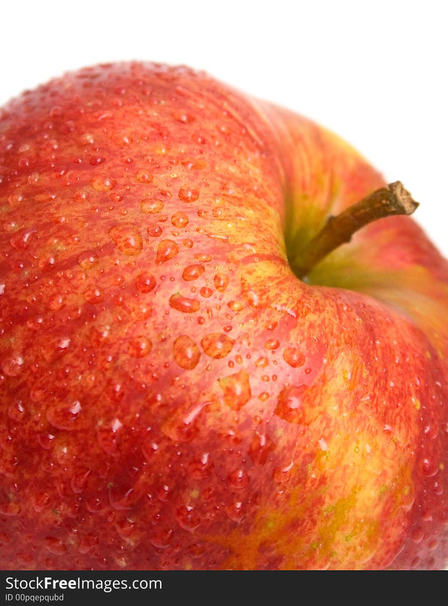 Fragment of red apple with water drops on the white background. Isolated. Shallow DOF. Fragment of red apple with water drops on the white background. Isolated. Shallow DOF.